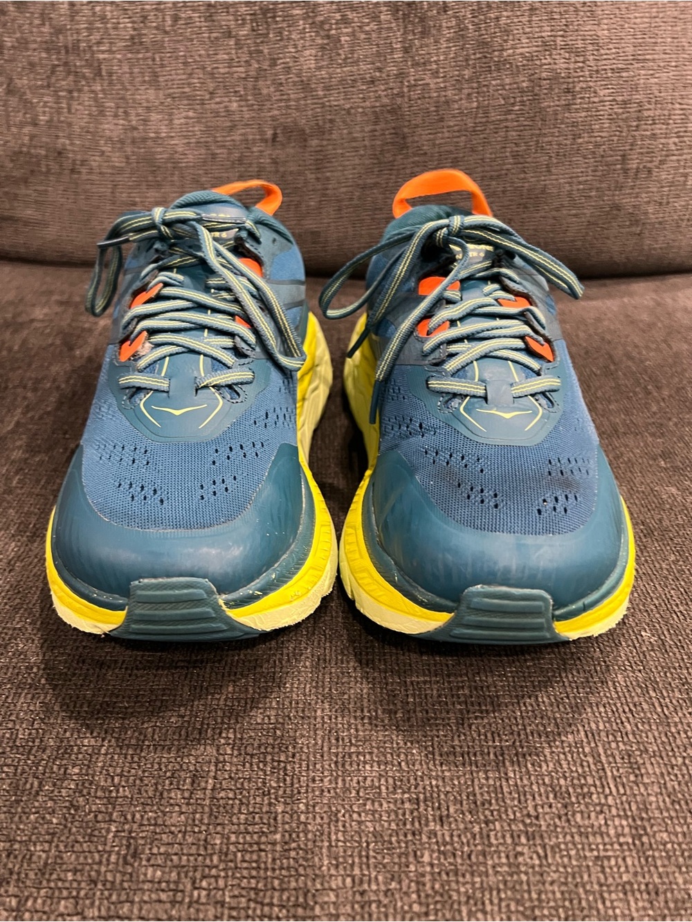 Hoka One One Teal Athletic Shoes with Yellow Soles and Orange Tabs